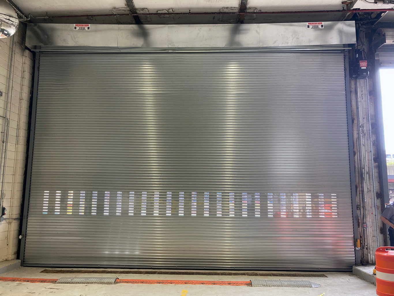 Rolling steal door with punched slats