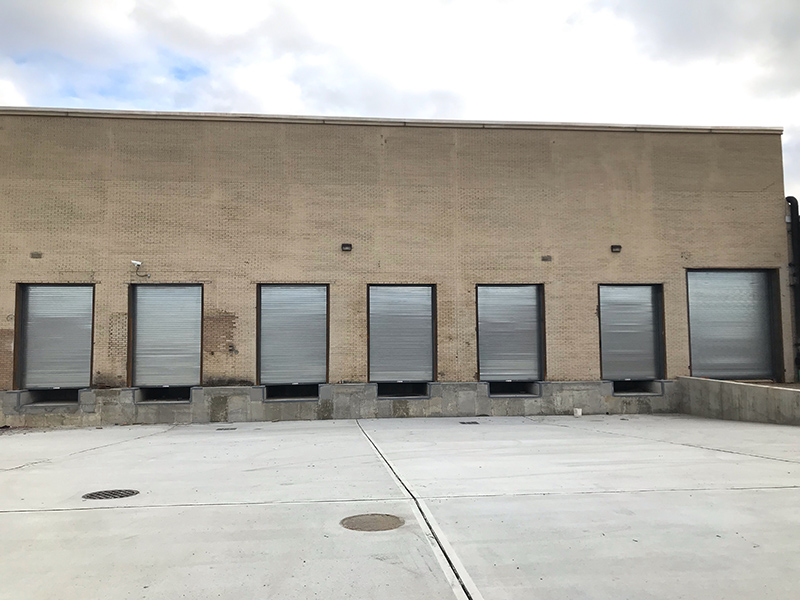 Distribution facility rolling doors installation after outside photo